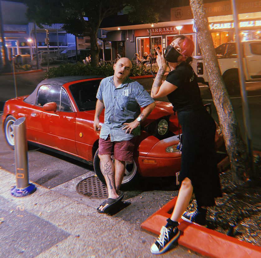 Me and my friend next to our NA MX5